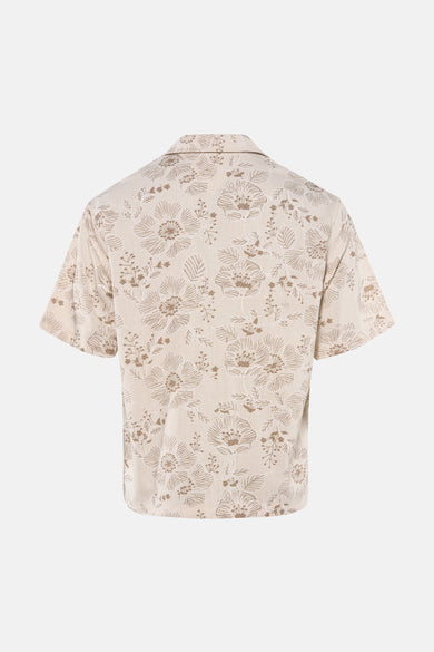Chemise beige à manches courtes de Guess, avec un motif floral.
