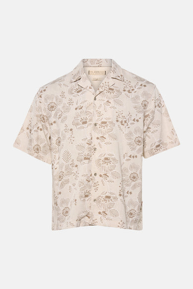Chemise beige à manches courtes de Guess, avec un motif floral.