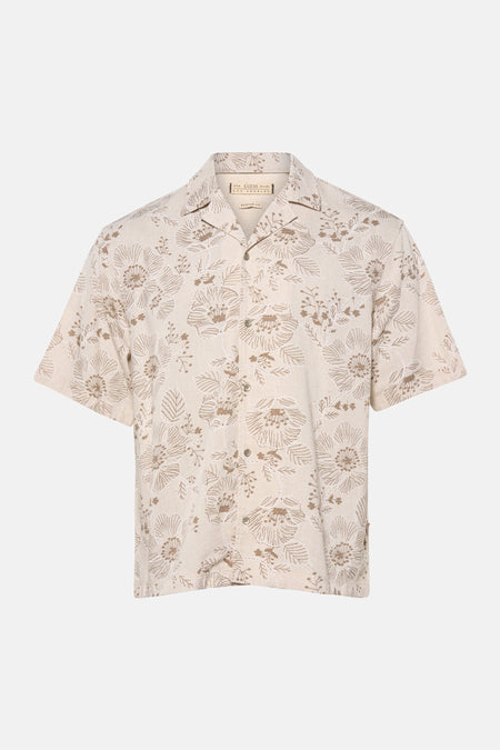 Chemise beige à manches courtes de Guess, avec un motif floral.
