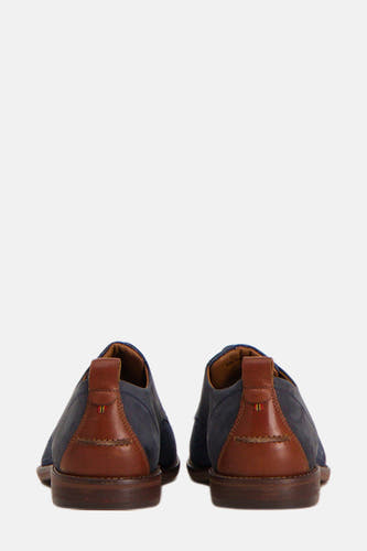 Bottines bleues de Le Fabuleux Marcel de Bruxelles, avec des détails en cuir marron à l'arrière.