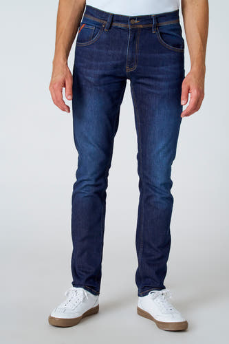 Jean slim fit bleu marine de Le Fabuleux Marcel de Bruxelles, avec des surpiqures brunes sur les poches et l'arrière.
