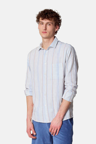 Chemise bleue à longues manches de Le Fabuleux Marcel de Bruxelles, avec des rayures verticales et une poche po.