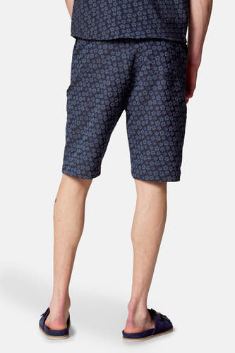 Shorts bleus de Le Fabuleux Marcel de Bruxelles, avec un motif floral.