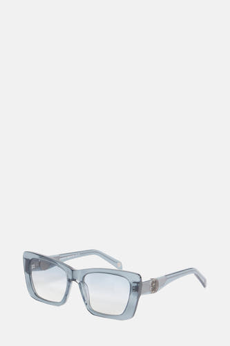Lunettes de soleil bleues de Le Fabuleux Marcel de Bruxelles, avec une décoration argentée ronde sur la monture.