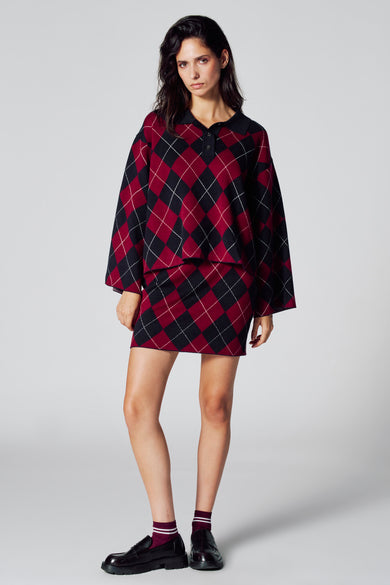 Sweat-shirt multicolore de Le Fabuleux Marcel de Bruxelles, avec un motif à carreaux en rouge et noir.
