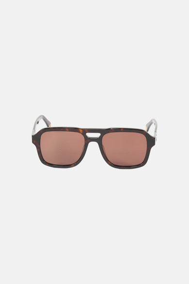 Lunettes de soleil marron de Le Fabuleux Marcel de Bruxelles, avec un motif écaille de tortue sur la monture.