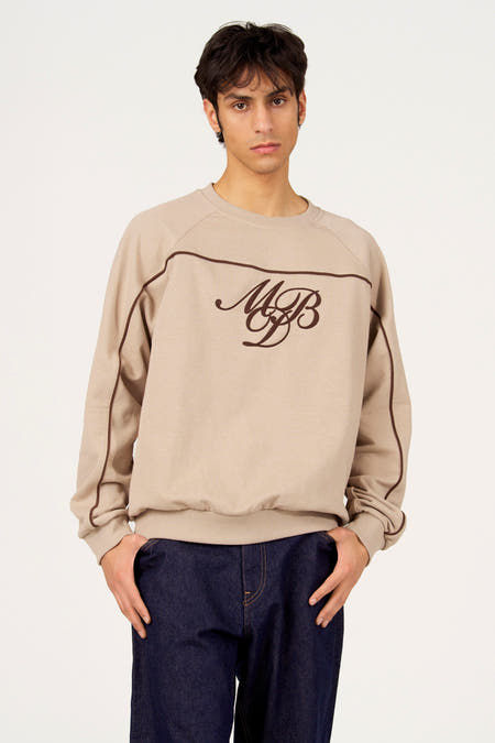 Grijze sweater met ronde hals van Le Fabuleux Marcel de Bruxelles, met bruine accenten en logo.