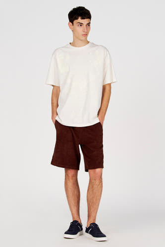 T-shirt blanc à manches courtes de Le Fabuleux Marcel de Bruxelles, avec un motif léger sur le devant.