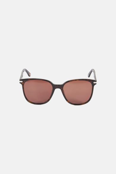 Lunettes de soleil marron de Le Fabuleux Marcel de Bruxelles, avec un motif écaille de tortue sur la monture et de subtils détails argentés.