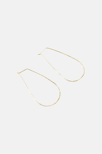 Boucles d'oreilles dorées de Le Fabuleux Marcel de Bruxelles avec un design minimaliste en forme de goutte.