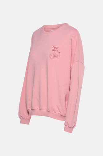 Gilet rose de Le Fabuleux Marcel de Bruxelles, avec un col rond et une impression graphique sur la poitrine.