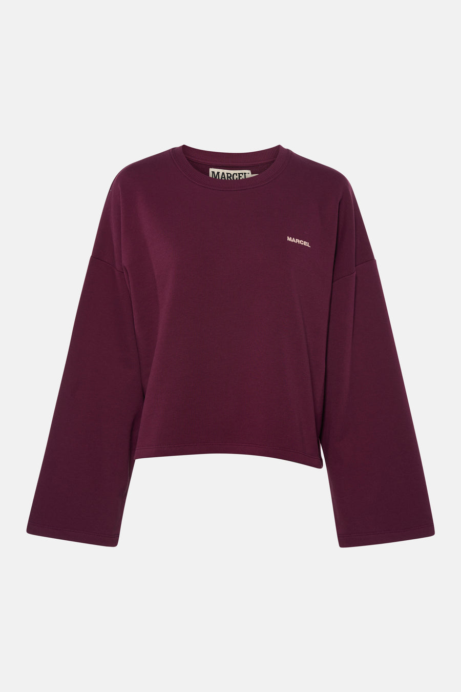 Pull violet à col rond de Le Fabuleux Marcel de Bruxelles, avec inscription 'MARCEL' marron clair sur la poitrine et une étiquette logo noir et blanc dans le cou.
