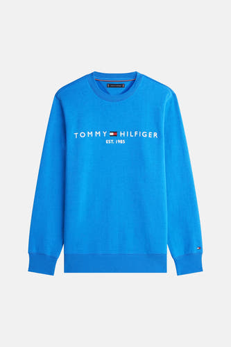 Pull bleu à col rond de Tommy Hilfiger, avec impression de logo blanc sur la poitrine.