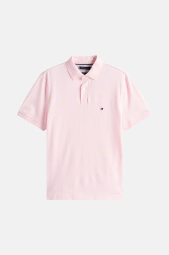 Polo rose à manches courtes de TOMMY HILFIGER, avec un petit logo brodé sur la poitrine.