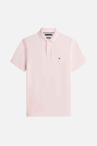 Polo rose à manches courtes de TOMMY HILFIGER, avec un petit logo brodé sur la poitrine.