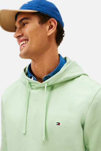 Pull-over vert vert Tommy caponononfigfigfig,res avec et et et petit logo sur sur.
