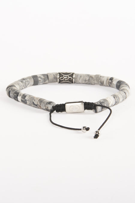 Bracelet gris NORTHMEN avec des pierres rondes et une fermeture à glissière argentée.