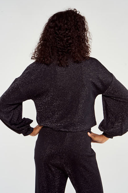 Zwarte trui met ronde hals van NOOR BY NORA GHARIB, met lange mouwen en glitterende textuur.