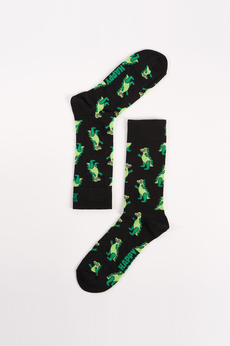 Chaussettes noires de Happy Socks avec un motif de dinosaure vert et le mot "HAPPY".