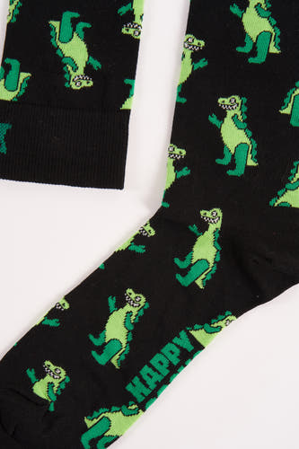 Chaussettes noires de Happy Socks, avec un motif de dinosaure vert et le mot "HAPPY" imprimé dessus.