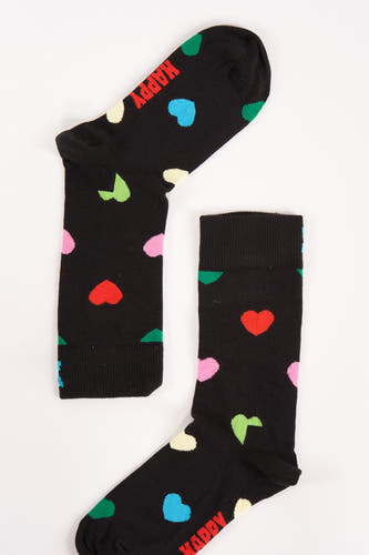 Chaussettes noires de Happy Socks, décorées de cœurs colorés et du texte 'Happy'.