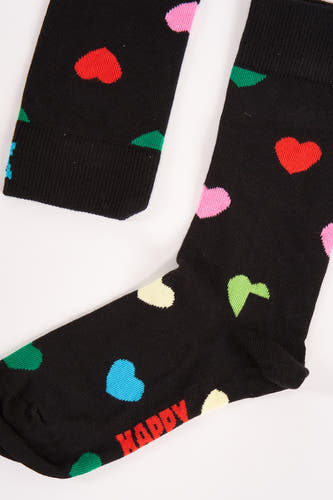 Zwarte sokken van Happy Socks, versierd met kleurrijke hartjes en de tekst 'Happy'.
