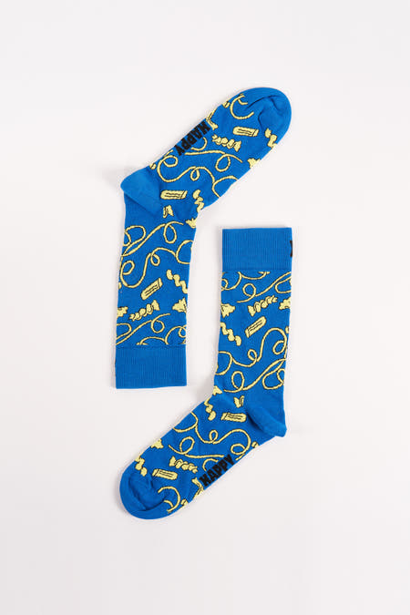 Chaussettes bleues Happy Socks® avec un motif ludique de boucles jaunes et d'objets.