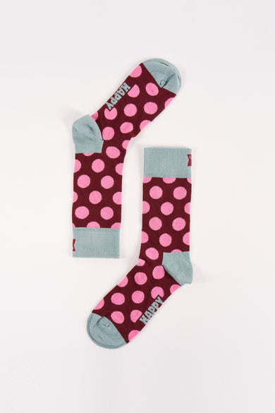Chaussettes rouges à rayures de Happy Socks, avec un bord bleu clair et le logo "HAPPY".