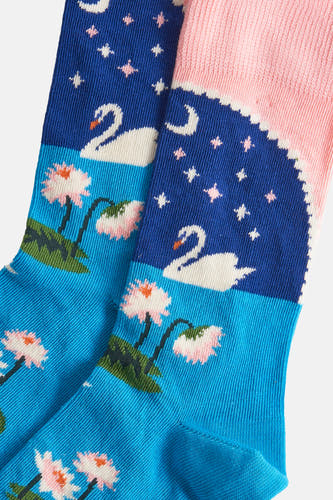 Chaussettes multicolores de Happy Socks® avec des cygnes, des lotus, des étoiles et une lune.