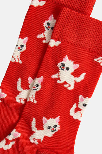Chaussettes rouges de Happy Socks® avec un motif ludique de chats blancs et de détails roses.