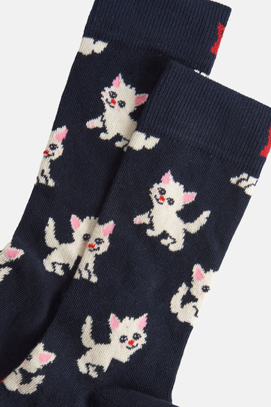 Chaussettes bleues de Happy Socks® avec un joli motif de petites chattes blanches et des accents roses.