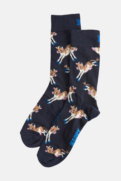 Chaussettes bleues de Happy Socks® avec un motif de vaches en blanc et brun.
