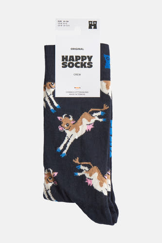 Chaussettes bleues de Happy Socks avec un imprimé de vaches sautantes.