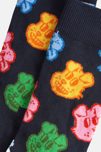 Chaussettes multicolores de Happy Socks, avec un motif coloré de personnages de dessins animés.