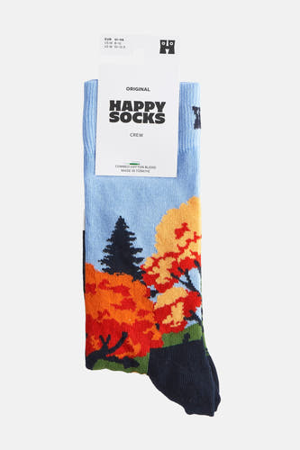 Chaussettes bleues de Happy Socks avec un motif de arbres d'automne et une pointe marine.