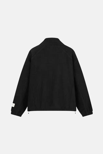Veste noire d'ANOTHER COTTON LAB, vue de dos, avec des manches longues et un col haut.