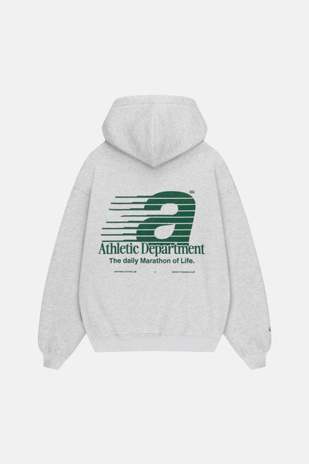 Grijze sweater met kap van ANOTHER COTTON LAB, met groene "Athletic Department" print op de rug.