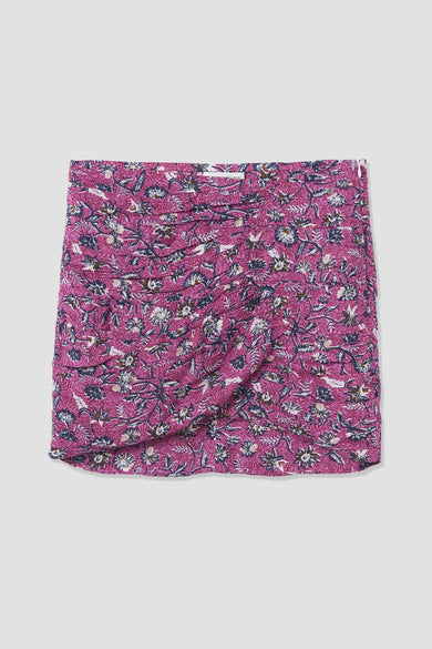 Robe courte rose de BROWNIE, avec un imprimé floral complet et un détail drapé.
