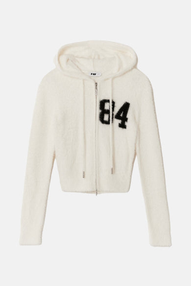 Cardigan blanc de TALLY WEIJL, avec capuchon, longues manches et "84" noir sur la poitrine.