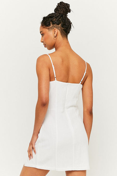 Robe blanche sans manches de TALLY WEIJL, dos avec fines bretelles et coupe ajustée, modèle de profil.