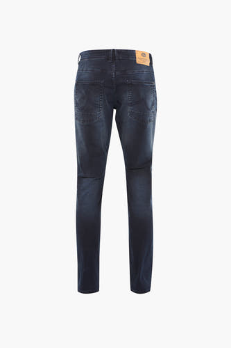 Jean slim bleu marine de Petrol Industries avec des poches arrière et une étiquette en cuir brun.