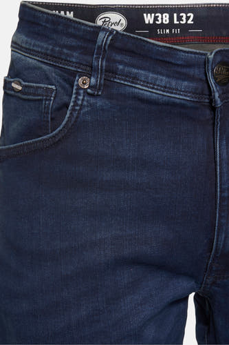 Jean slim bleu de Petrol Industries, avec des boutons et des poches à l'avant.