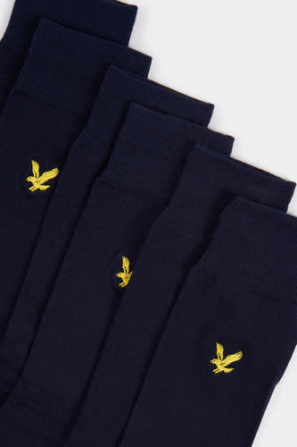 Chaussettes bleues de LYLE & SCOTT, avec un logo jaune brodé sur le genou.