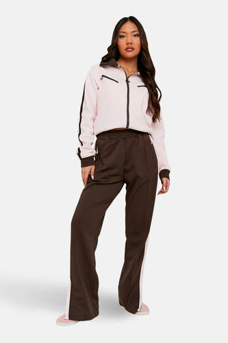 Pantalon de jogging marron de TALLY WEIJL avec une bande blanche sur le côté et des jambes larges.