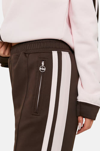 Pantalon de jogging marron de TALLY WEIJL avec des rayures blanches sur le côté et une fermeture éclair sur la poche.