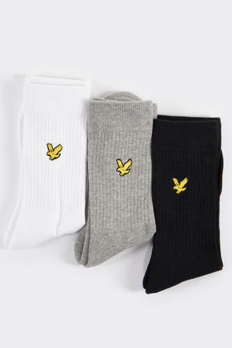 Chaussettes blanches de LYLE & SCOTT, avec une texture rayée et le logo brodé en jaune.