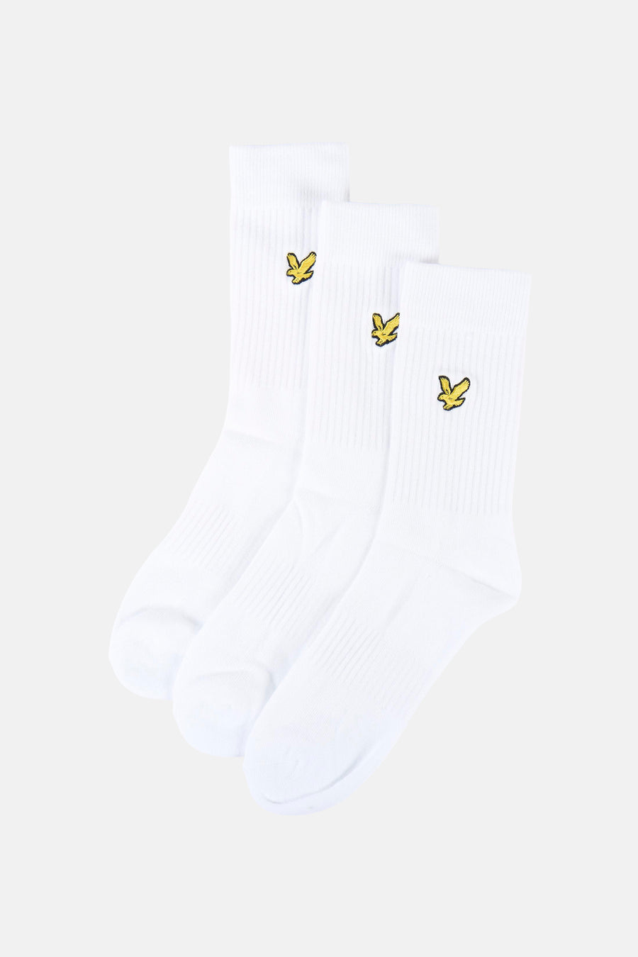 Chaussettes blanches de LYLE & SCOTT, emballées avec une bande jaune portant le logo et le texte.