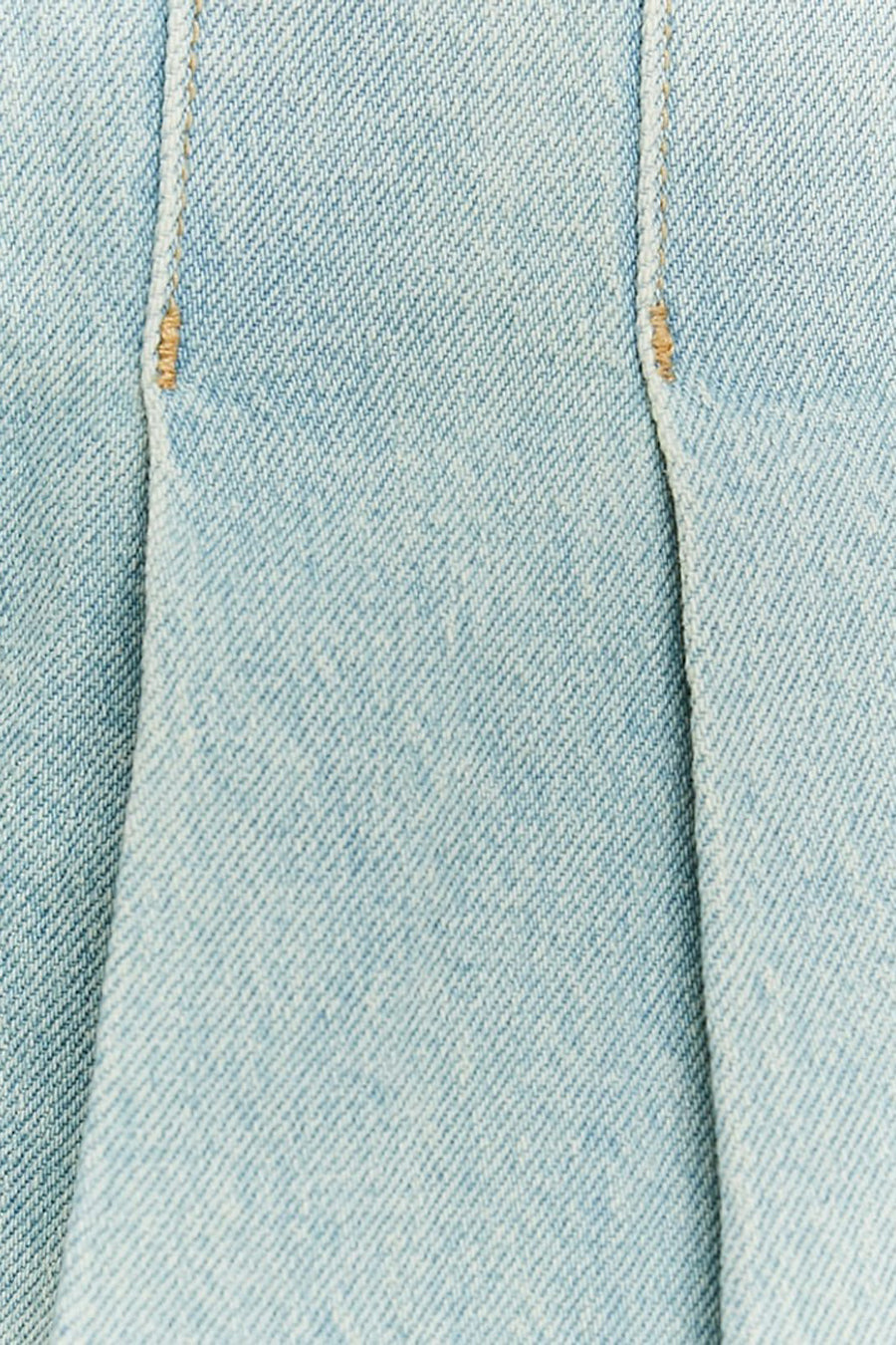 Short skirt of light blue denim from TALLY WEIJL, with stitches and folds, close-up.