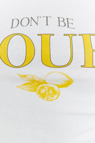 Débardeur blanc TALLY WEIJL avec l'inscription 'Don't be sour' et une image de citron.