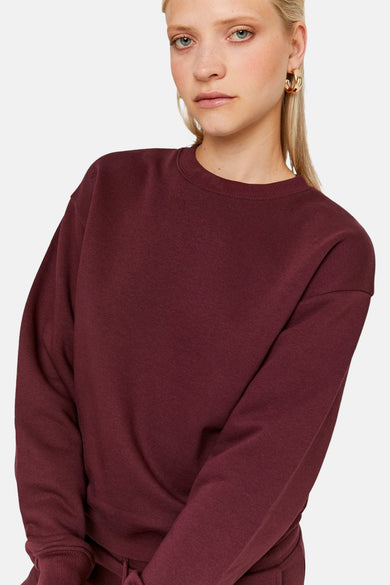 Gilet de couleur bordeaux de TALLY WEIJL, avec un col rond et des manches longues.